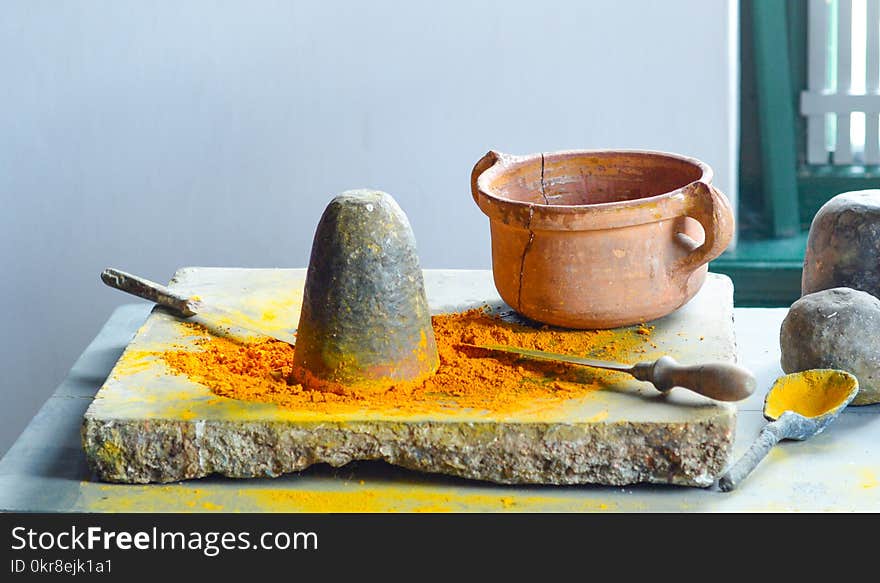 Brown Clay Pot on Gray Surface