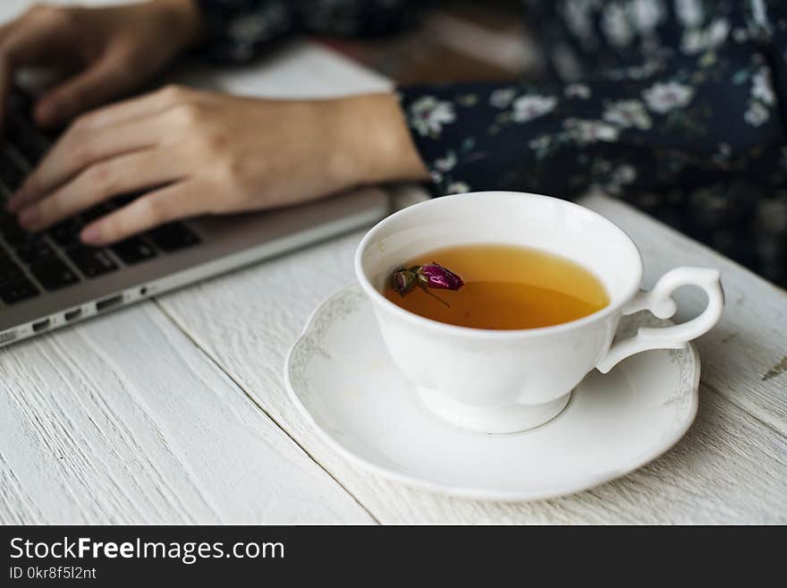 White Ceramic Cup With Brown Liquid on Brown Wooden Table