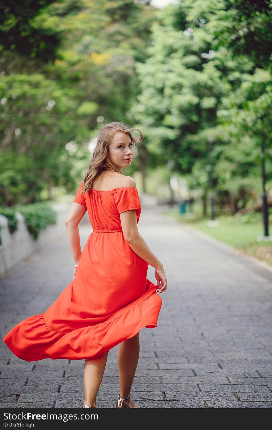 Woman Wearing Orange Off-shoulder Dress