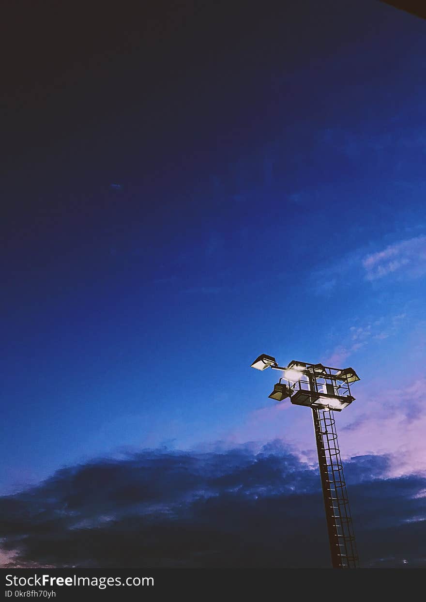 Light Tower Under Blue Cloudy Skies