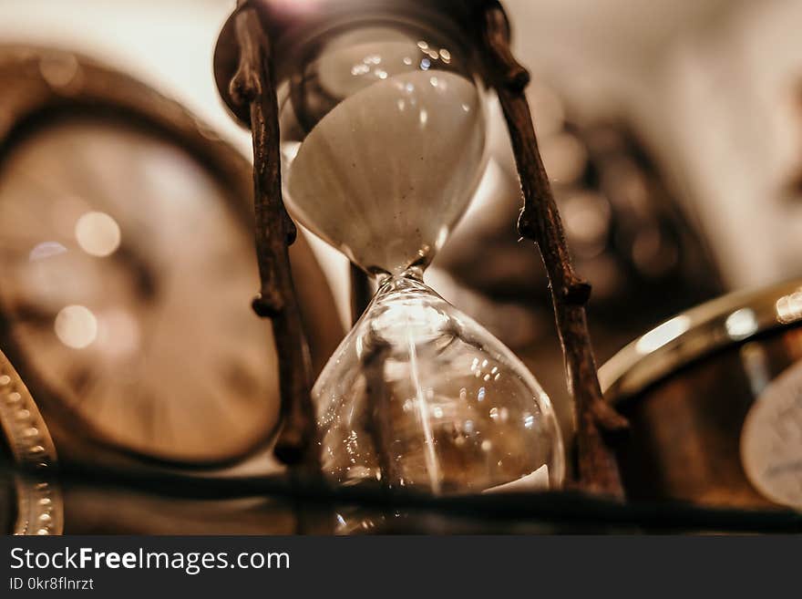 Shallow Focus Photography of Hourglass