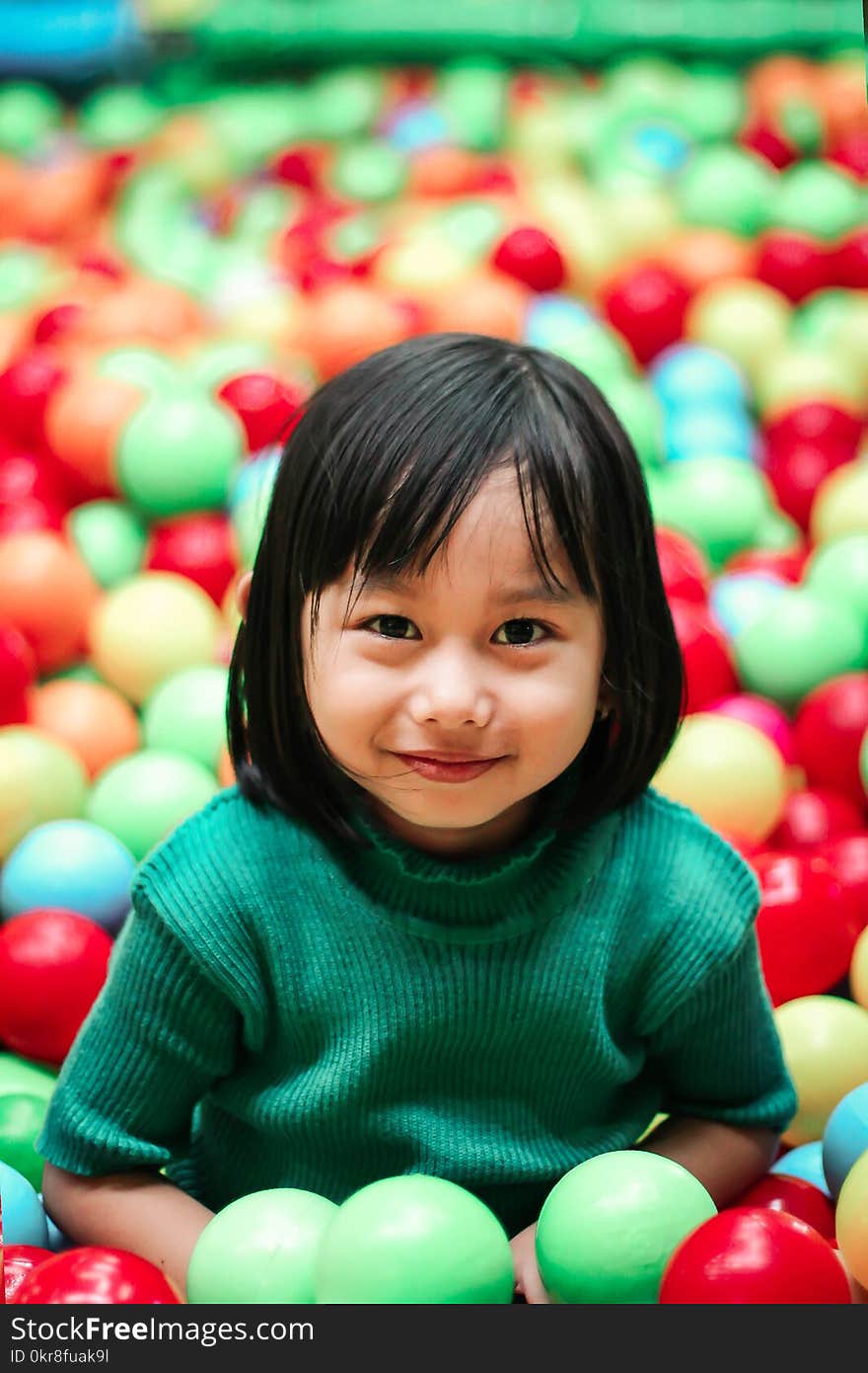 Girl Wearing Green Knit Shirt