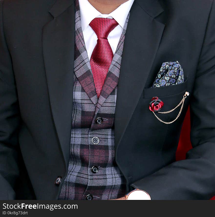 Man Wearing Black Notched Lapel Suit Jacket