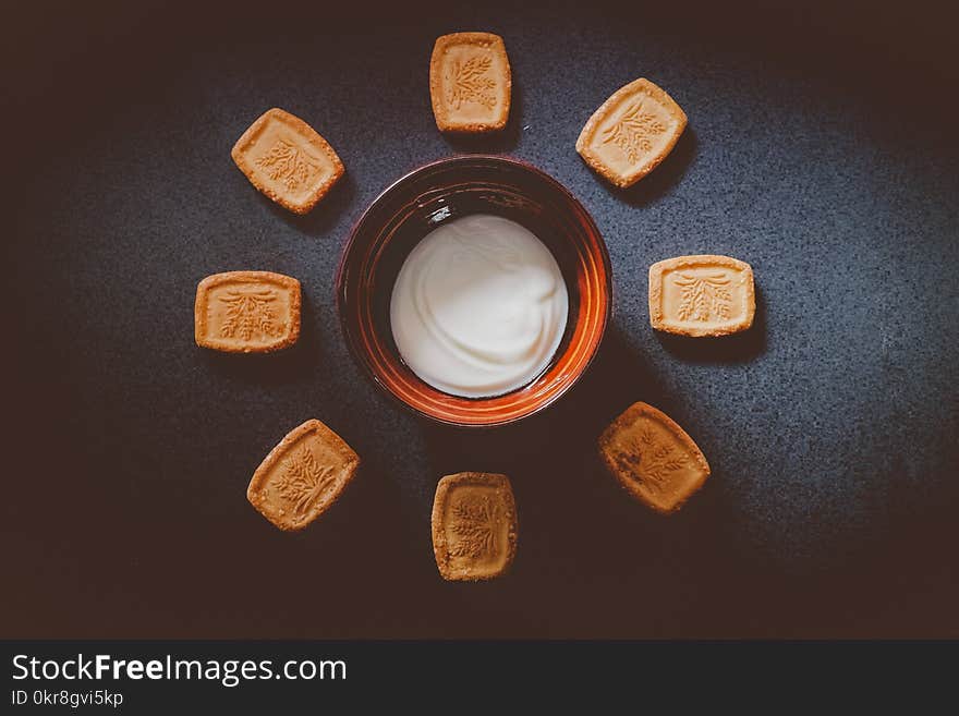 White Sauce on Bowl With Biscuits on Side