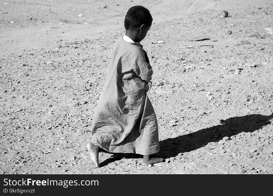 Photographed Grayscale of Child in Dress