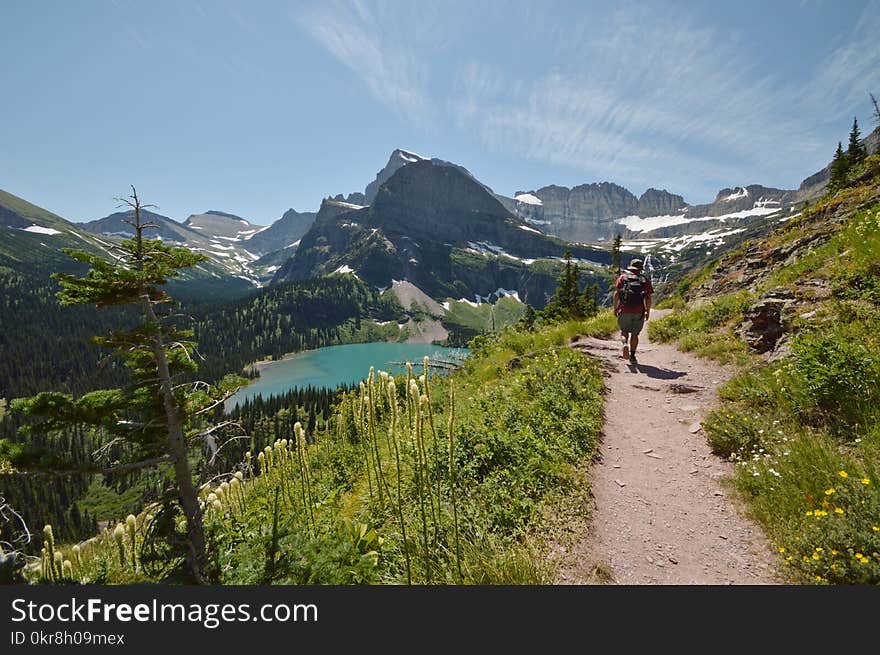 Man Walking on Road While on Mountain