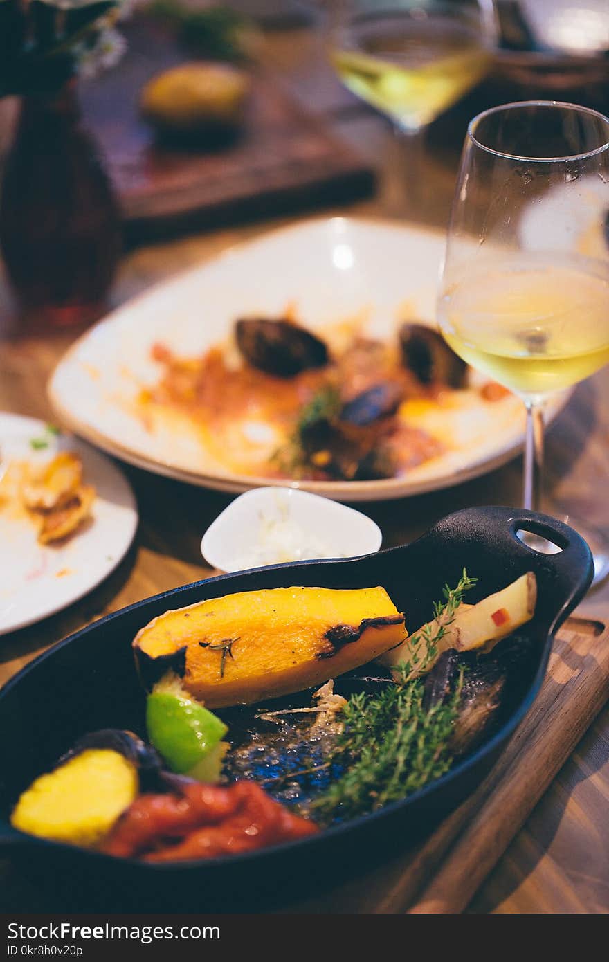 Sizzling Plate Filled by Sliced Fruit and Herb