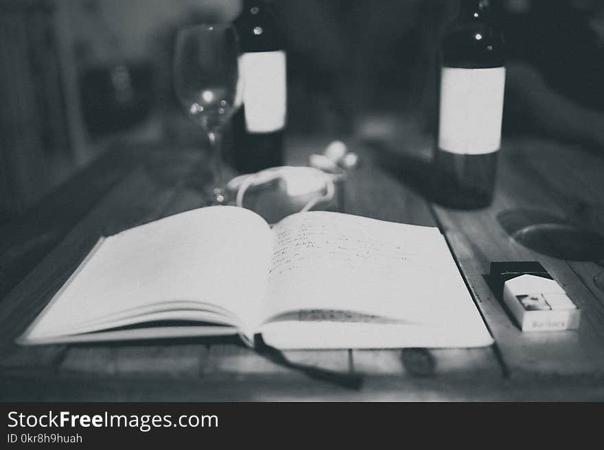 White Book on Gray Wooden Table Surface