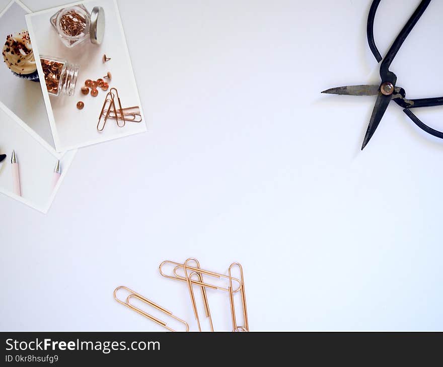 Flat Lay Photography of Paper Clips and Scissor