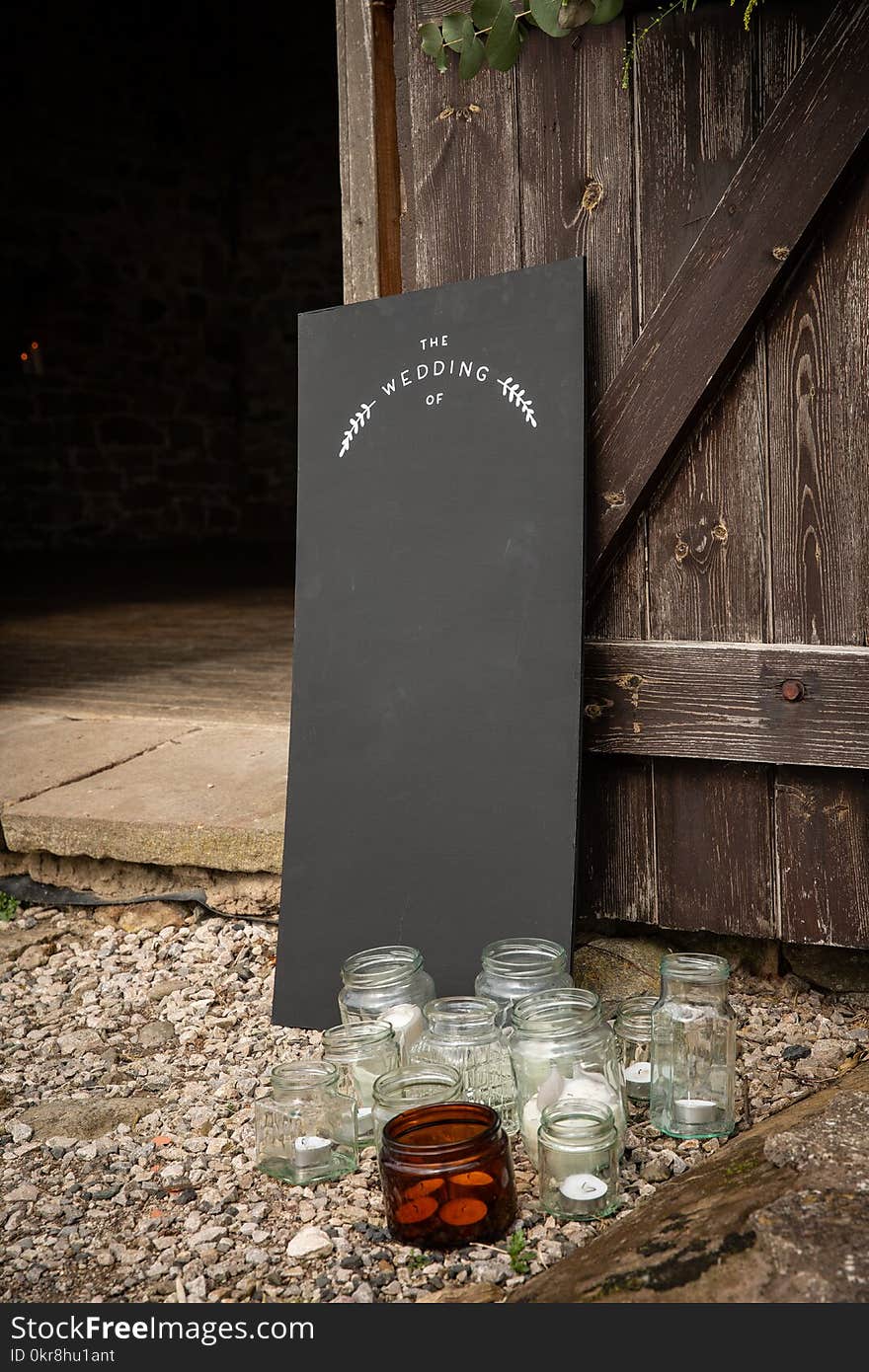 Clear Glass Jars Near Black Board