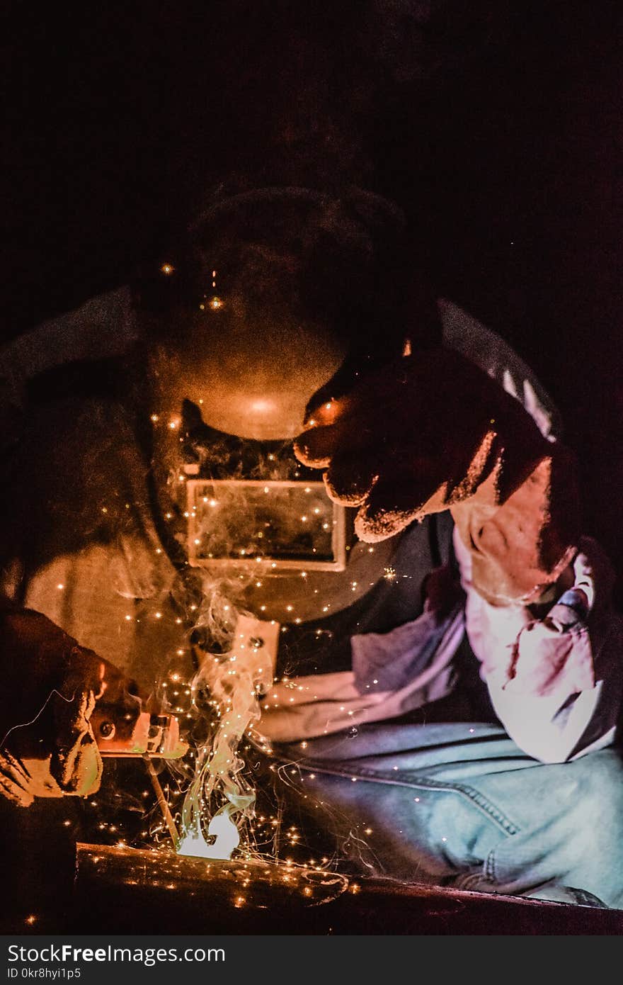 Photography of a Person Wearing Welding Mask