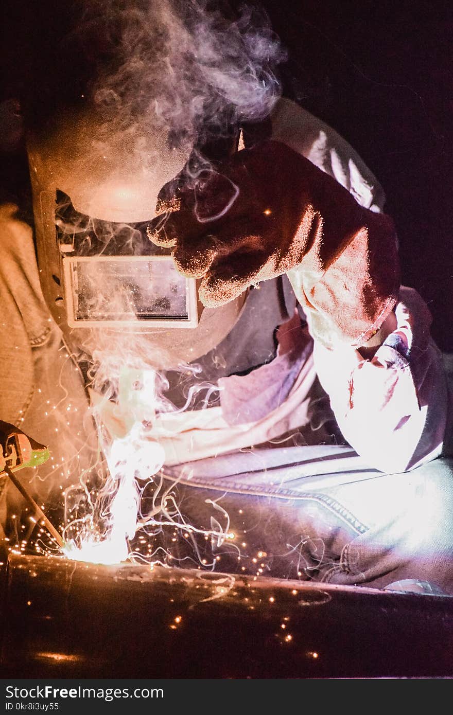 Photo of Person Wearing Welding Mask