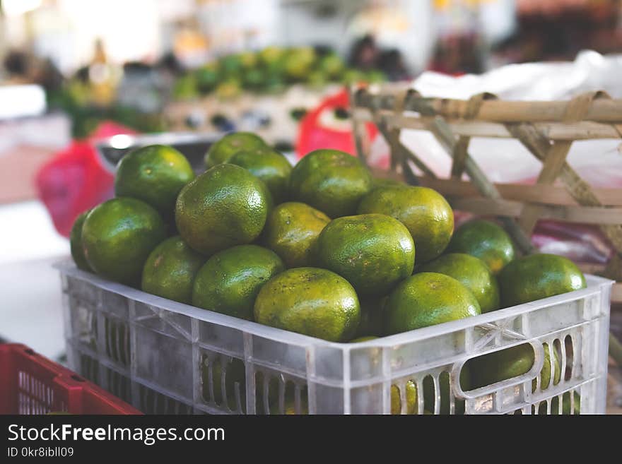 Crate of Round Green Fruits