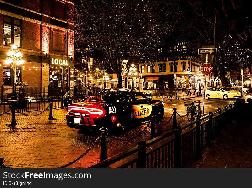 Photography of Police Car During Night Time