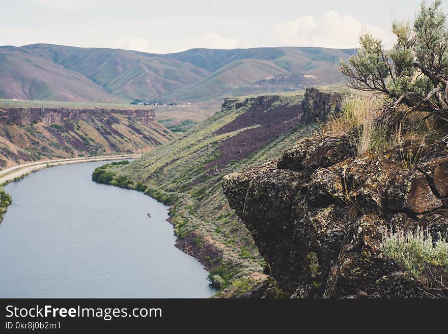 Body of Water Between Mountains