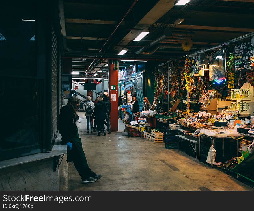 Man Standing in Front of Store