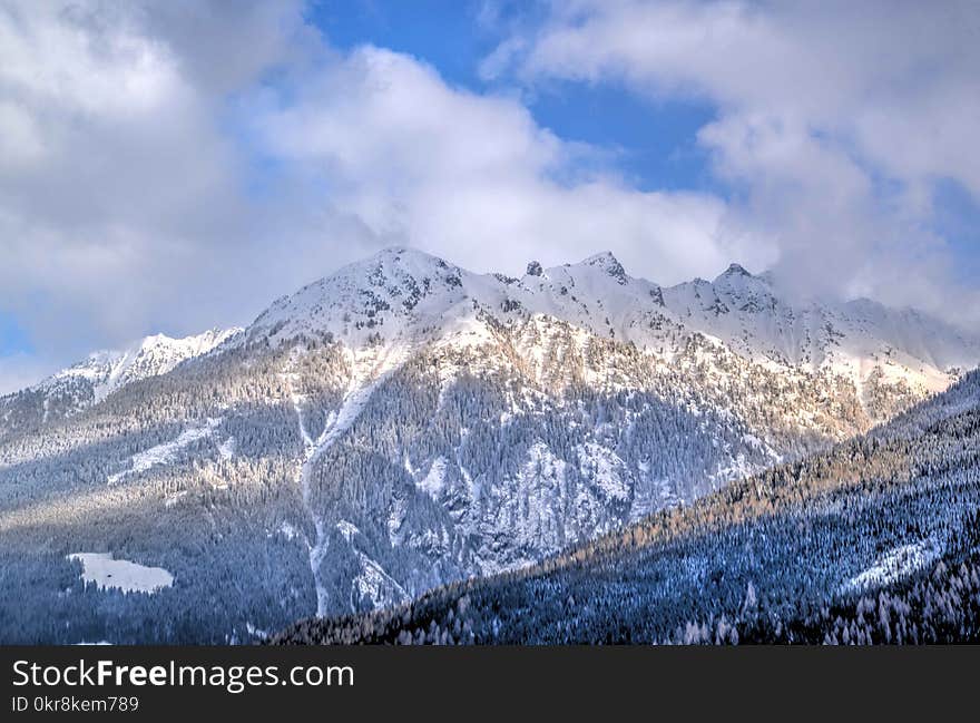 Brown Rock Formation Covered With White Snow