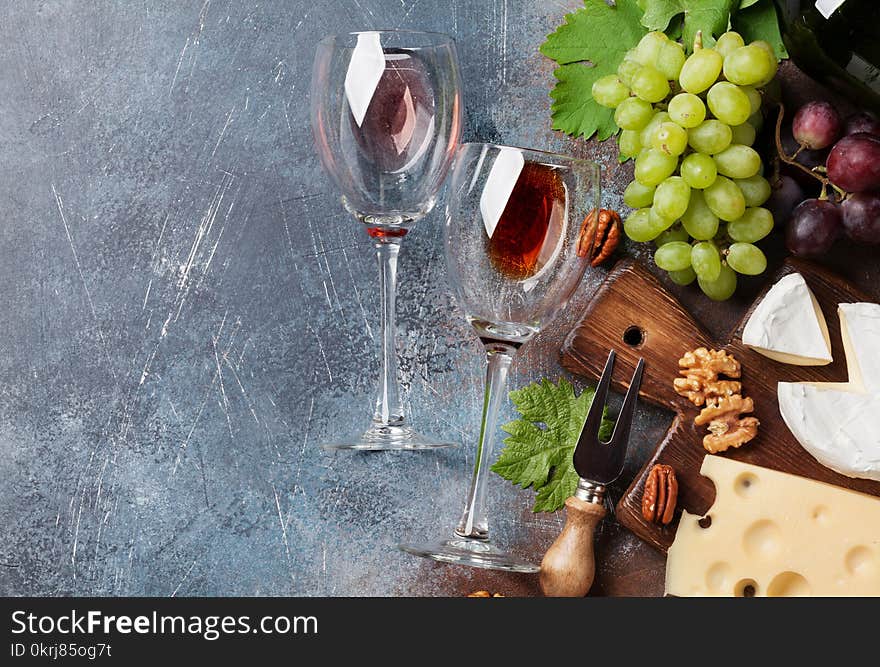 Wine, grape, nuts and cheese. Top view with space for your text. Wine, grape, nuts and cheese. Top view with space for your text