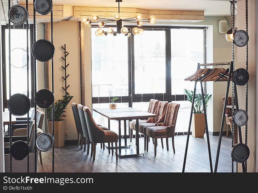 Modern and simple cafe interior with wooden classical furniture.