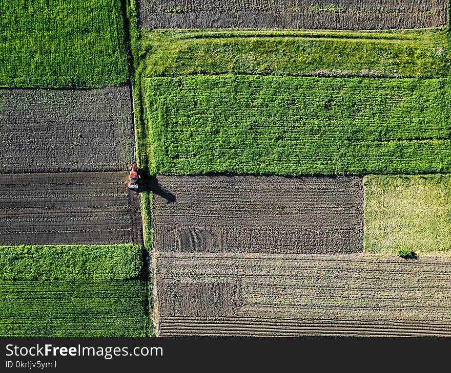 Aerial view work of a tractor in the field. Agricultural work. Photo from the drone. Aerial view work of a tractor in the field. Agricultural work. Photo from the drone