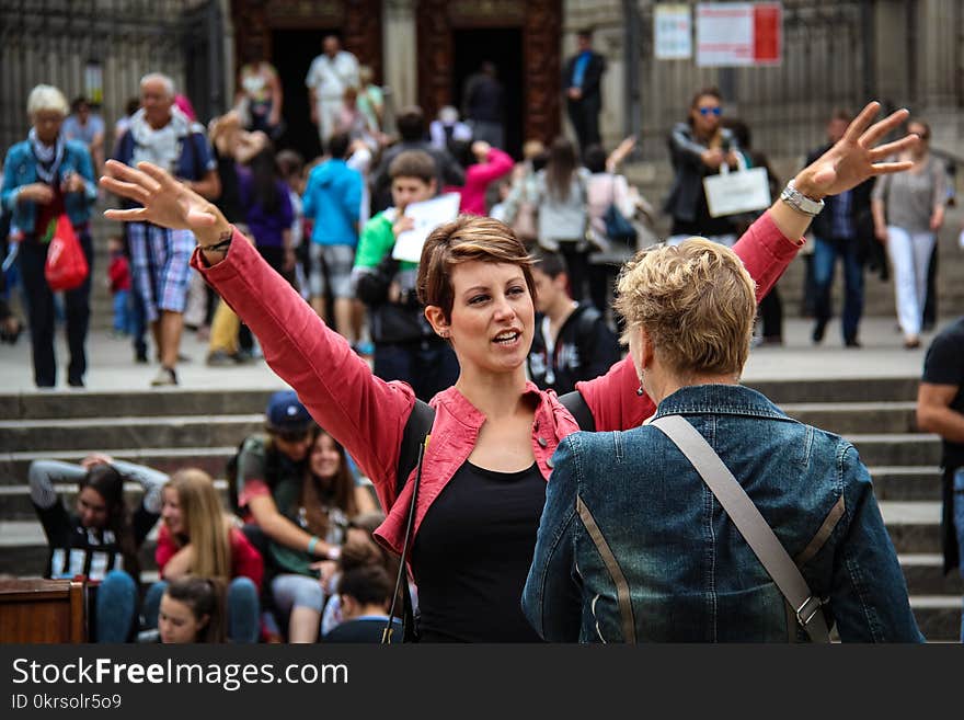 Woman Racing Hands Front of another woman