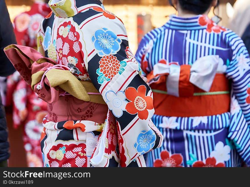 Young girl wearing Japanese kimono standing in front of Sensoji