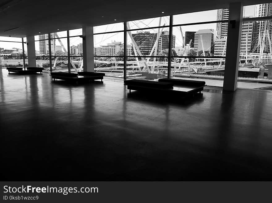 Three Couches in Hallway in Grayscale Photography