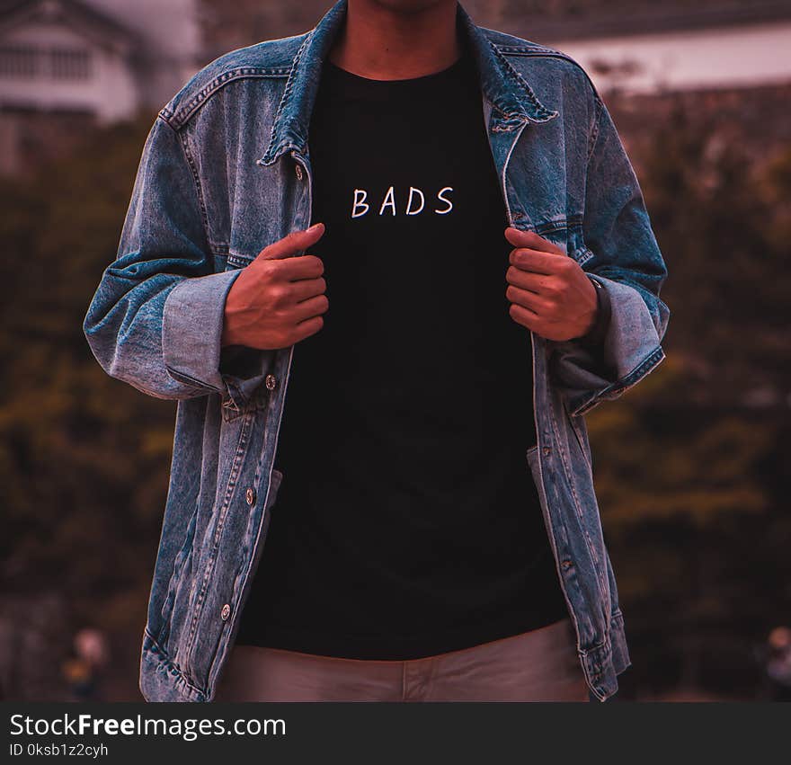 Man Wearing Black Bads Crew-neck Shirt Under Blue Denim Jacket