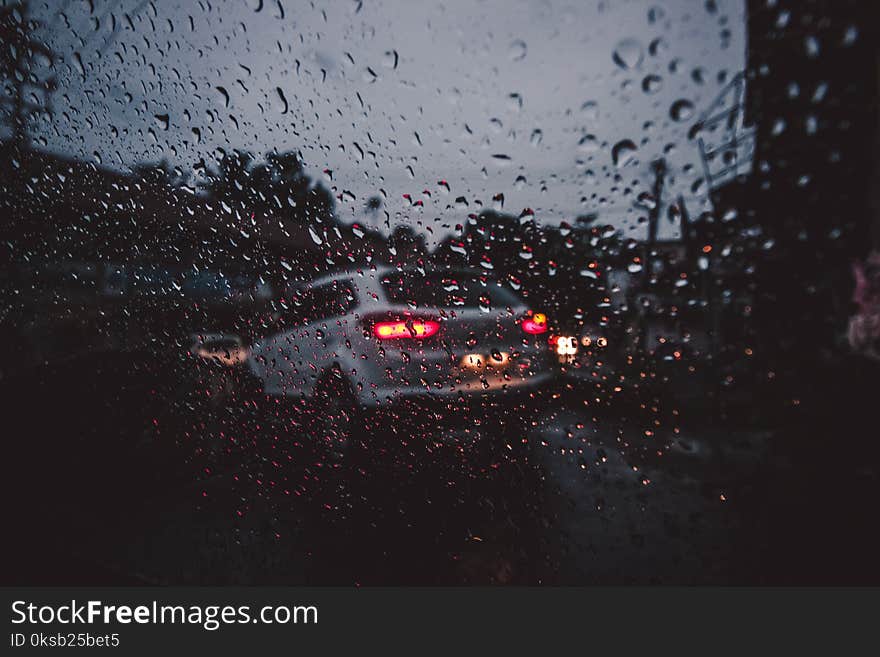 Silver Suv on Asphalt Road during Rain