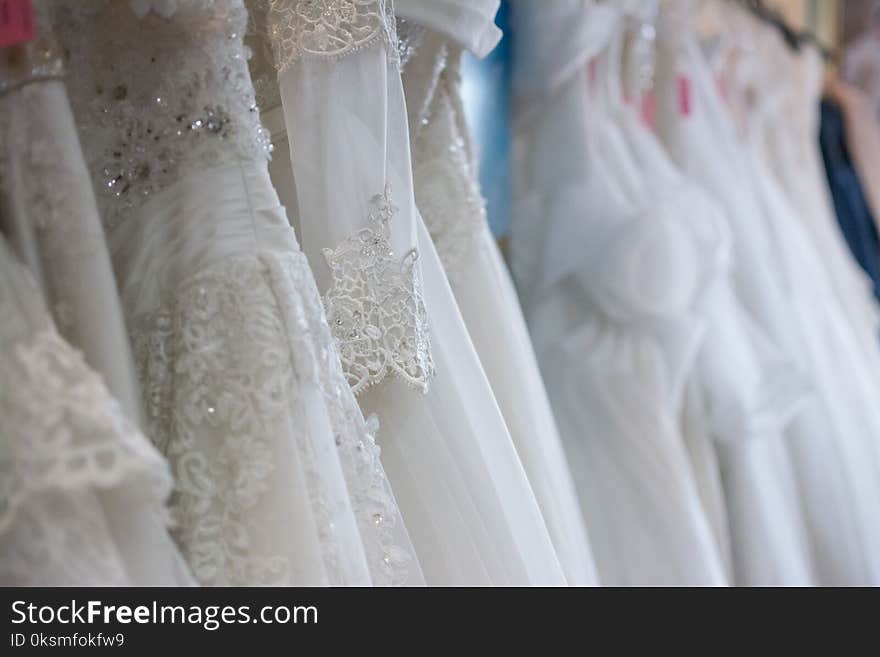 White wedding dresses hanging on racks,Thailand