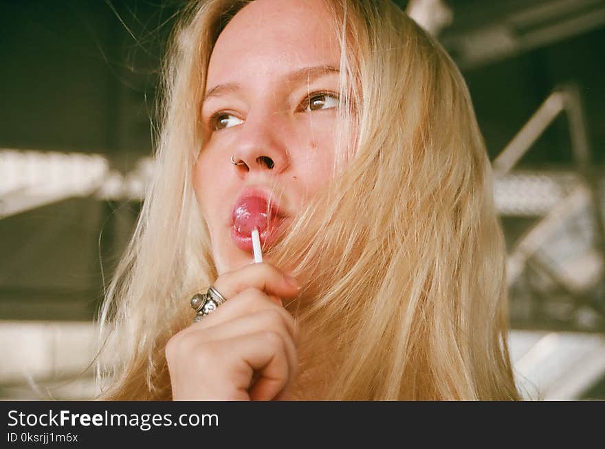 Woman Licking Lollipop