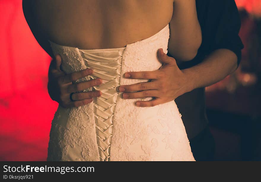 Person With Black Dress Shirt Holding Woman&#x27;s Waist Close-up Photo