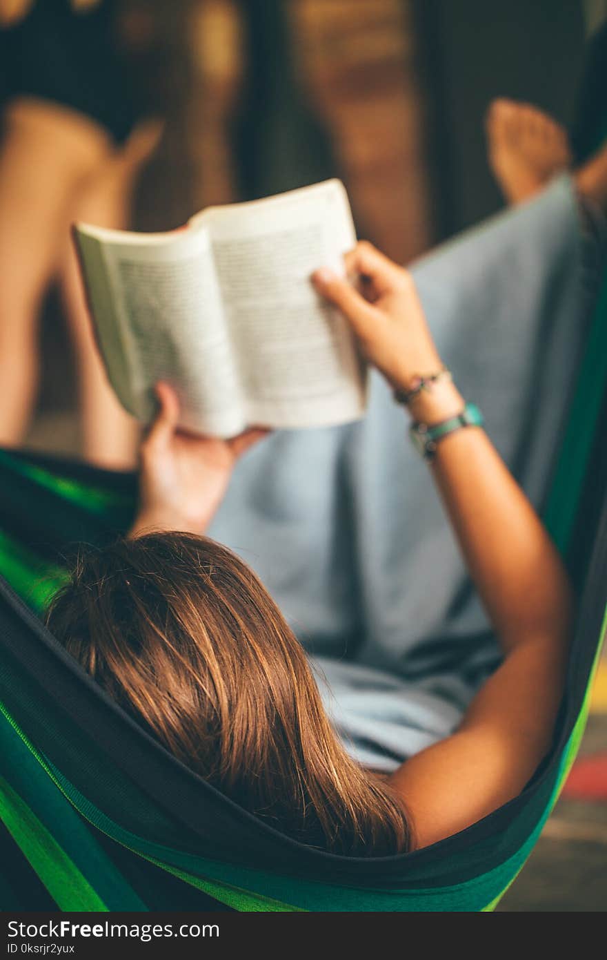 Woman on Hammock Reading Book