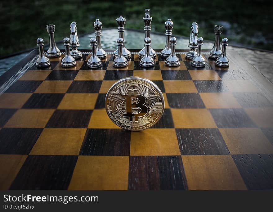 Close-up Photography of Coin on Chessboard