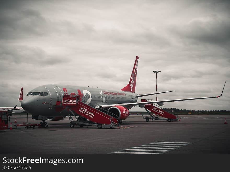 Grey And Red Airplane