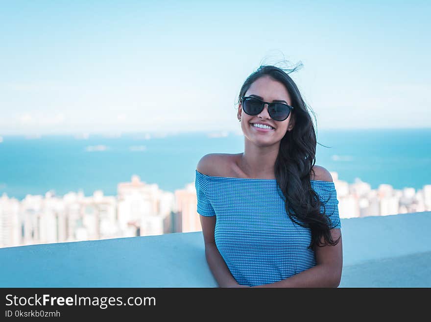 Woman Wearing Blue Off-shoulder Top Smiling