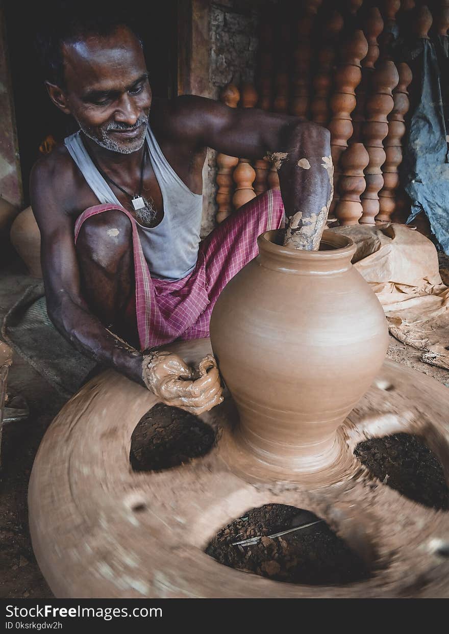 Man Making Clay Pot