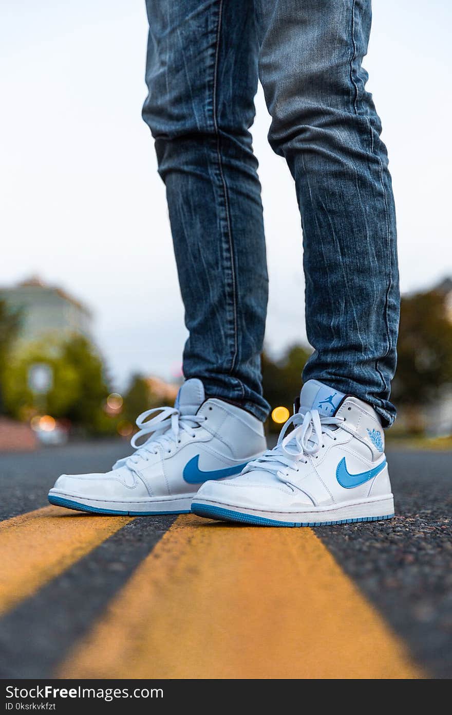 Person Wearing White And Blue Air Jordan 1&#x27;s