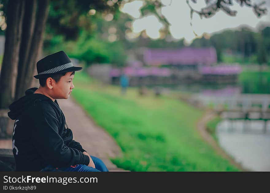 Boy Wearing Black Zip-up Hoodie And Black Fedora Hat