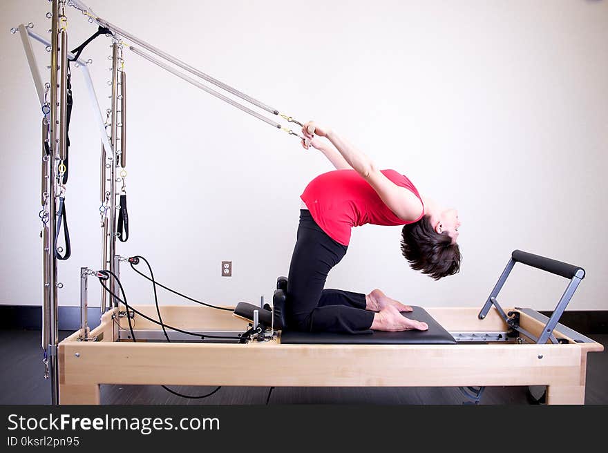 Woman Using Exercise Equipment