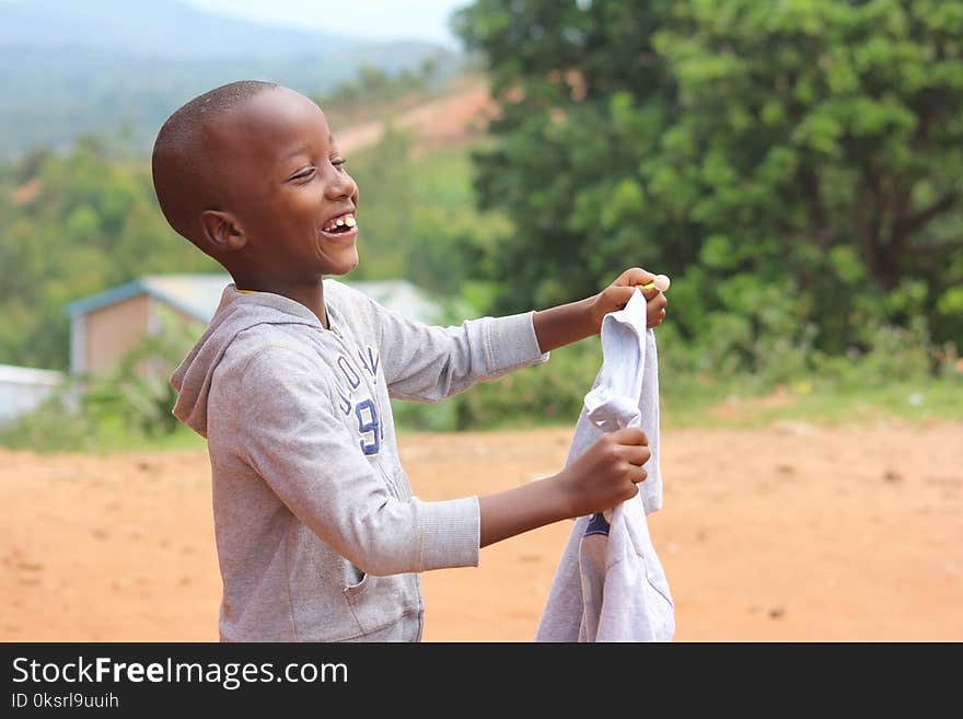 Smiling Boy Wearing Grey Hoodie