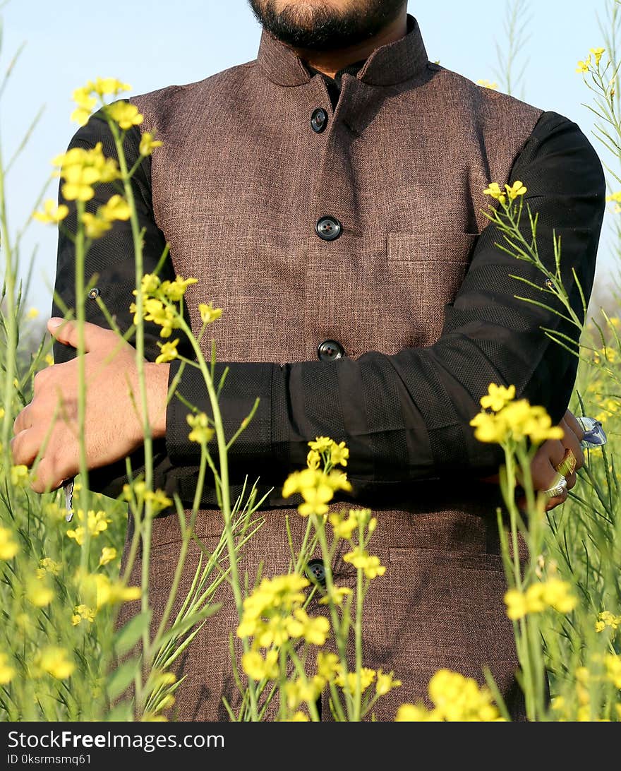 Man in Brown And Black Button-up Top