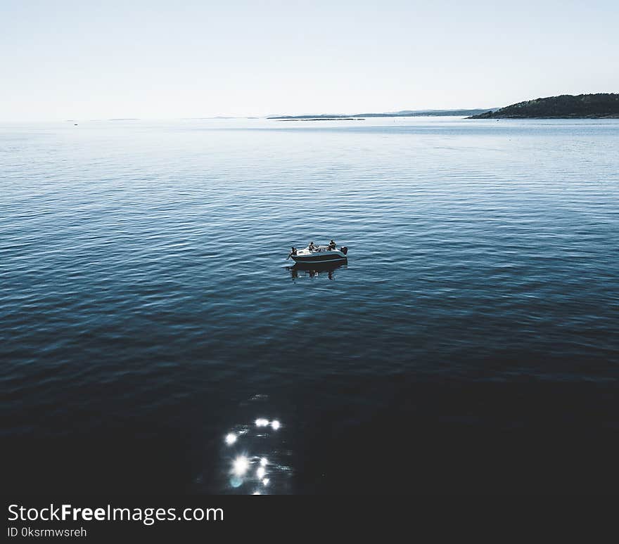 Two Person Riding Boat