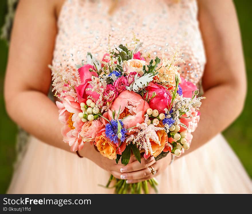 Beauty wedding bouquet in bride`s hands