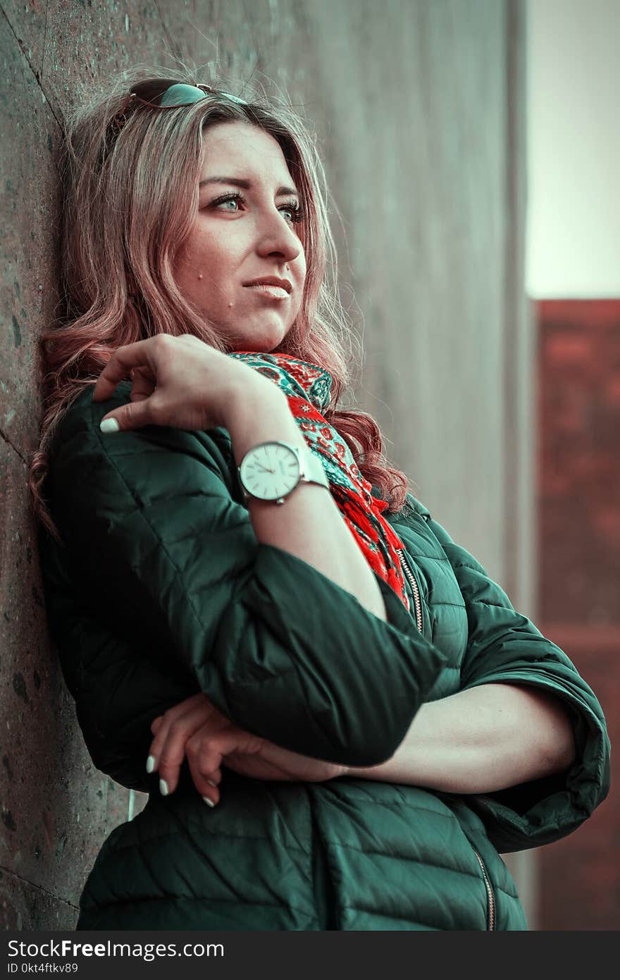 Beautiful modern girl near the brickwall in the rays of the evening sun. Youth style. Fashion shot. Beautiful modern girl near the brickwall in the rays of the evening sun. Youth style. Fashion shot.