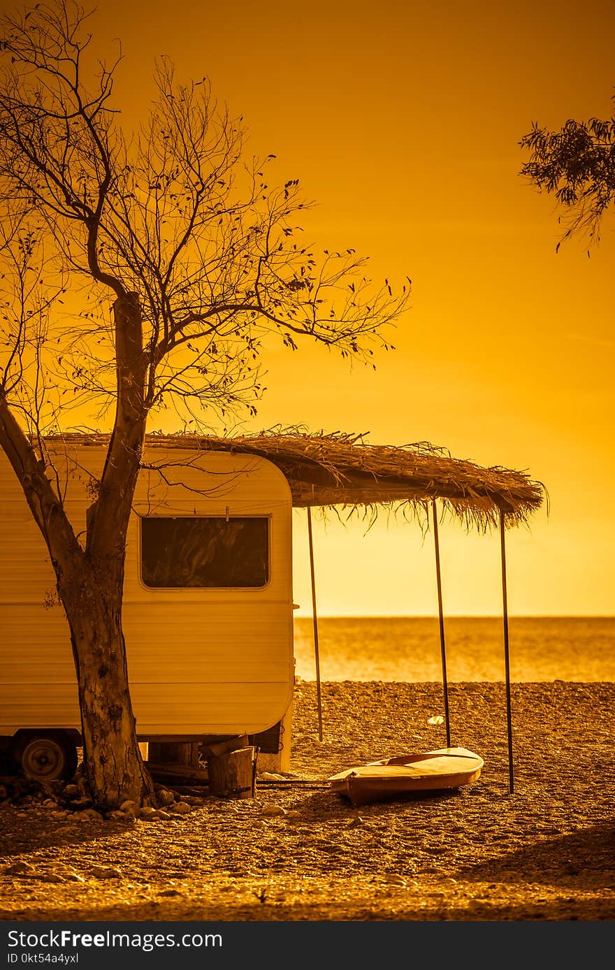 Tourism vacation and travel. Caravan trailer on sunny beach in Greece