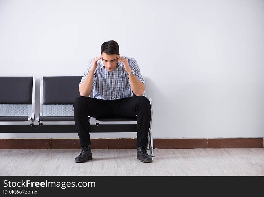 The man nervously impatiently waiting in the lobby