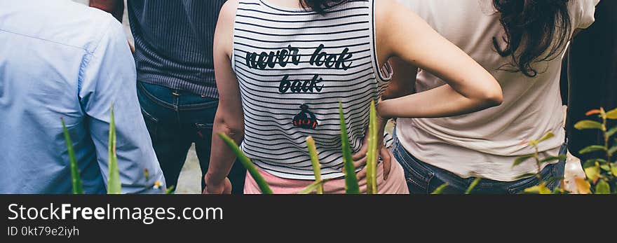 Person Wearing White and Black Striped Sleeveless Top