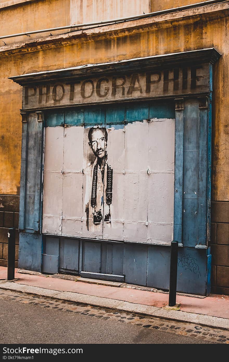 Brown and White Photographie Signage