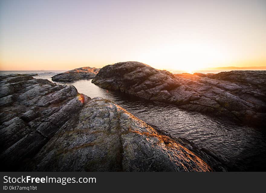 Rock Formation Near Body of Water